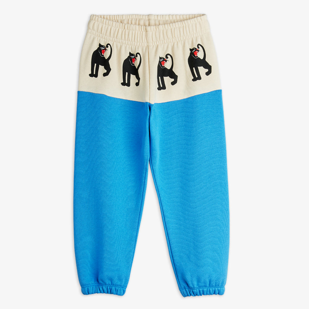 Mini Rodini Panther sweatpants | white hip bad with panther repeated print | beautiufl aqua bottom of pant  elasticized waist and ankles | organic cotton |  front of pant
