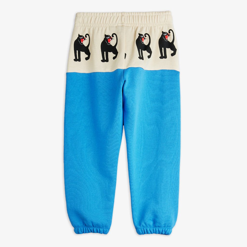 Mini Rodini Panther sweatpants | white hip bad with panther repeated print | beautiufl aqua bottom of pant  elasticized waist and ankles | organic cotton |  back of pant