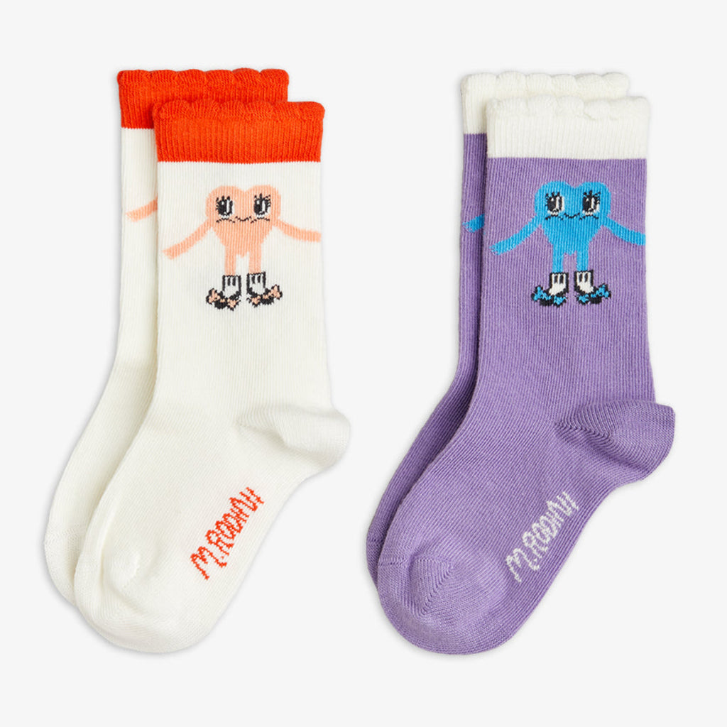 2-pack set of mid-calf sox by Mini Rodini | both with a smiling heart design wearing dress shoes! | one black sock with red trim, the second being lavender with white tripe