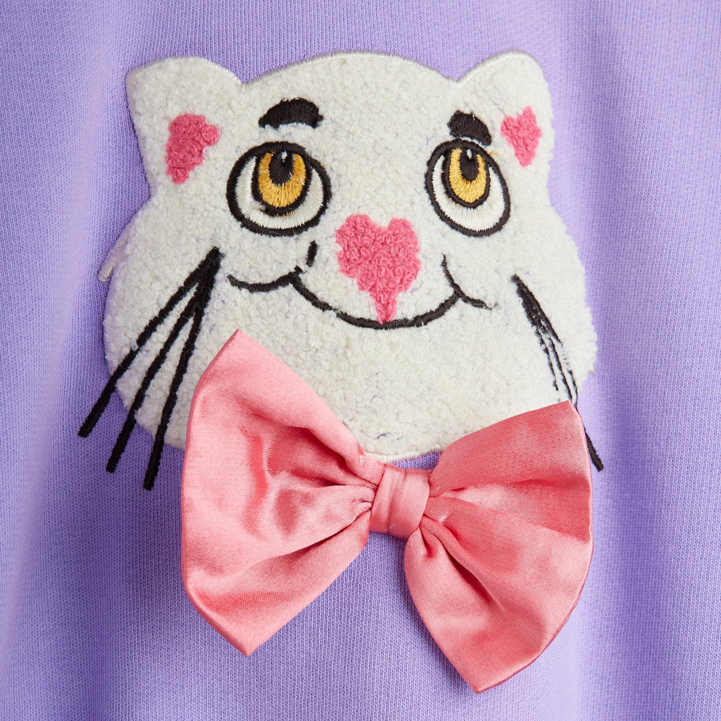Chenille Cat with a Bowtie on a lavender cotton sweatshirt | crew neck | ribbed at neck, wrist, waist | dropped shoulders | relaxed fit | modeled  | closeup
