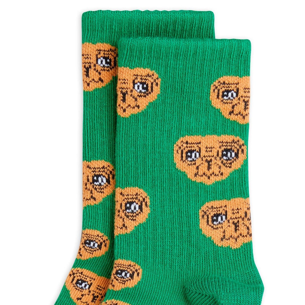 Mini Rodini Kids E.T. socks |all over E.T. head on green | closeup 
