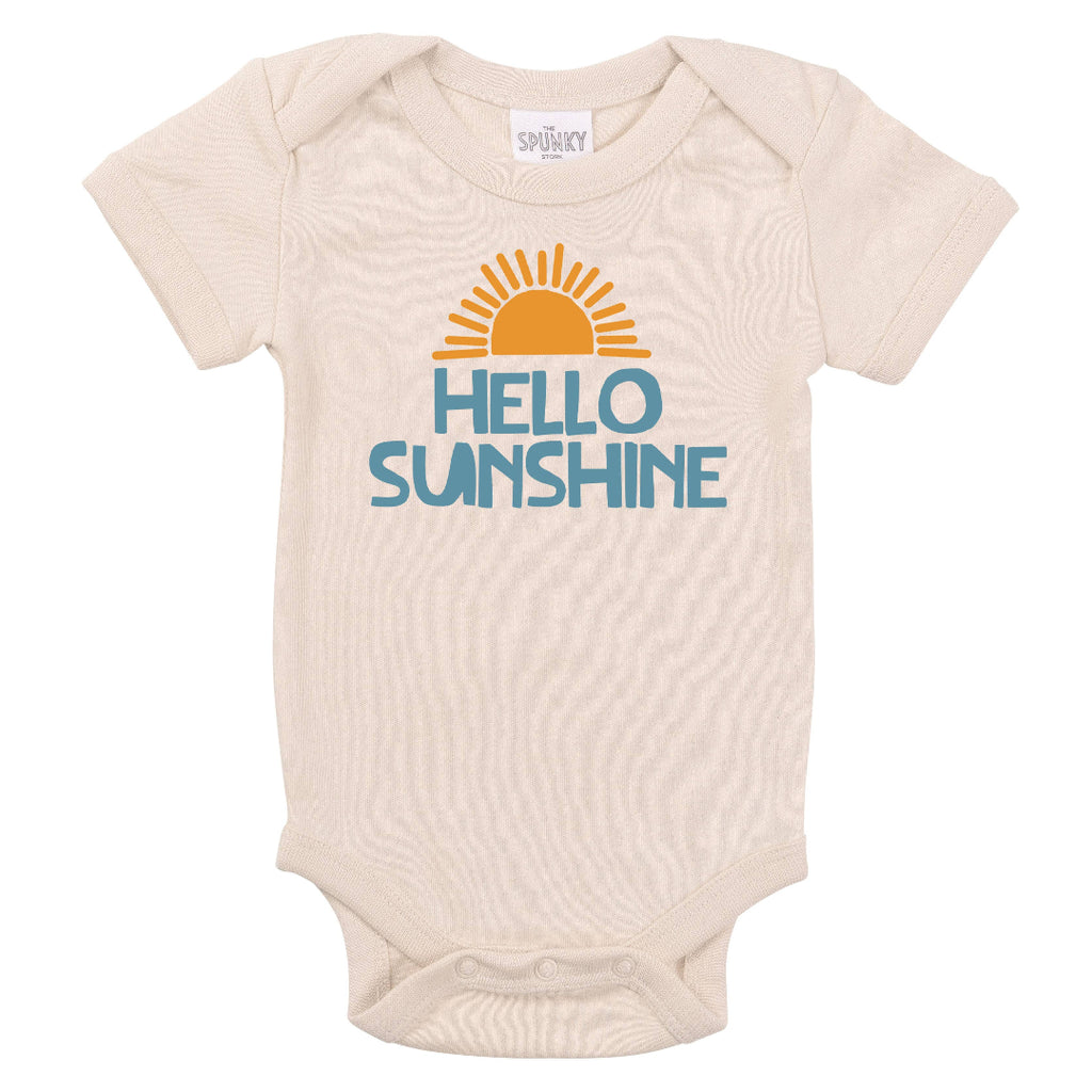 Hello Sunshine graphic on a sand color infant onesie | yellow sun with blue lettering | envelope neck opening | short sleeve | snaps at legs 