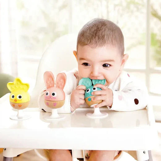 3 piece rattle set for infants | suction cups on each for attaching to a tray, table, etc. | small for little hands | non-toxic | nubbies on ears for teething