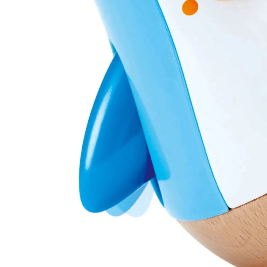 Musical Wobbling Penguin for ages 6 months and up | Arms flap as music plays when it wobbles | It starts to wobble when infant plays with it | no moving parts except the wings 'flap' a bit | 5" tall | wing closeup