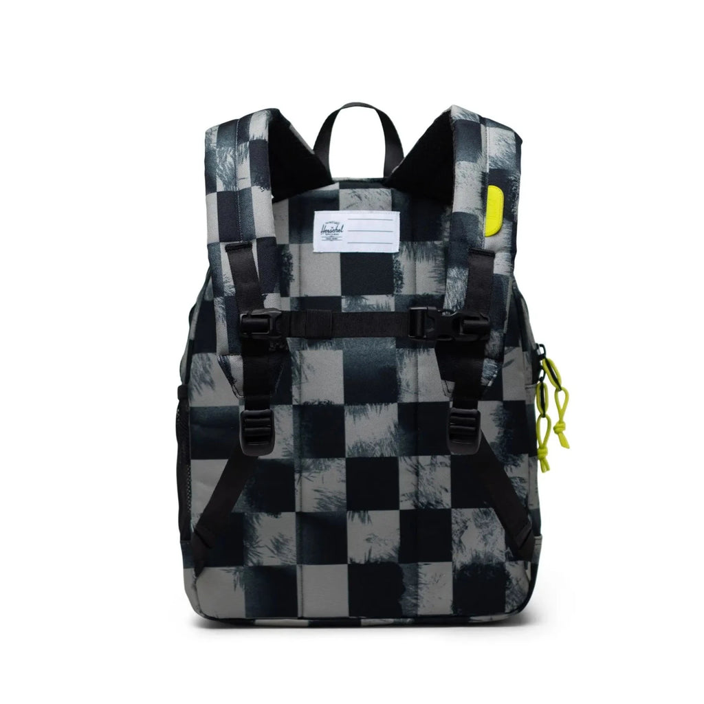 Herschel Youth Backpack | styled for 8-12 years | black Stencil Check | laptop sleeve | front pocket | water bottle holder  | made from recycled fabrics | 15"(H) x 12"(W) x 5.75"(D) - back