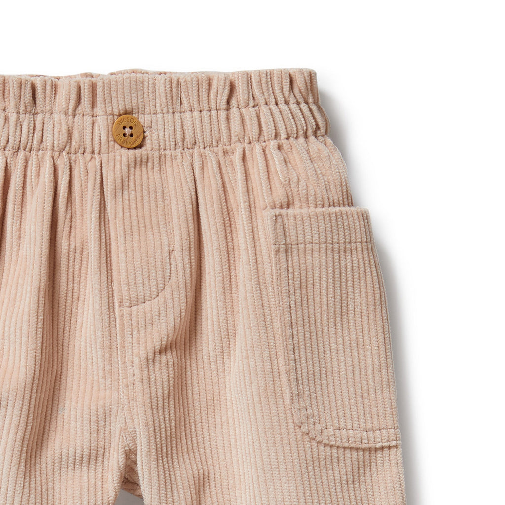 Rose corduroy pant for infant/toddler | soft elastic waist | functional button open in front | side pocket | 100% organic cotton | closeup