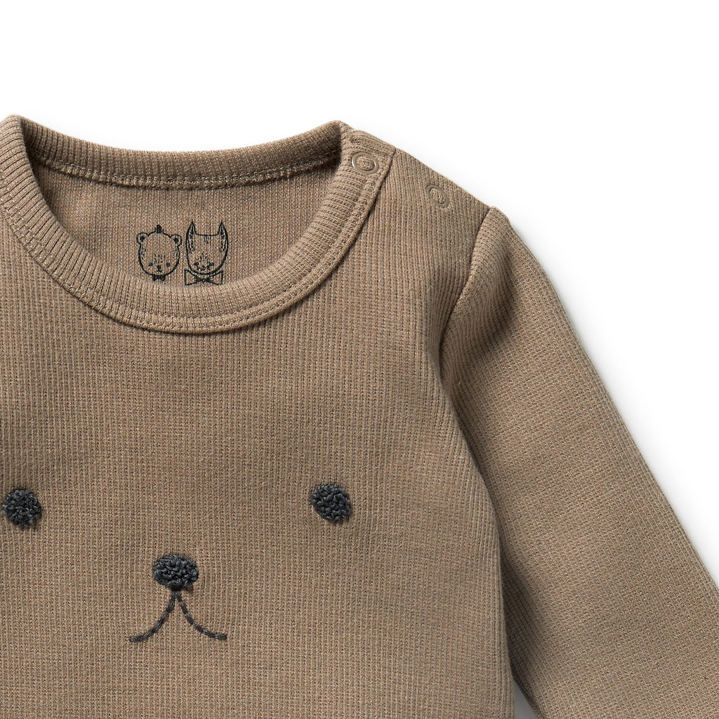 Soft ribbed, stretchy walnut color onesie | organic cotton | embroidered animal face | snaps at shoulder & legs | snug fitting | close up