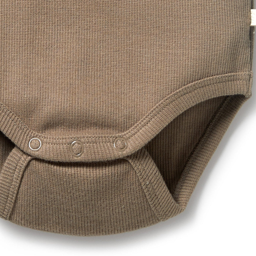 Soft ribbed, stretchy walnut color onesie | organic cotton | embroidered animal face | snaps at shoulder & legs | snug fitting | close up