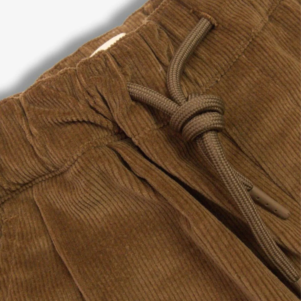 Kids brown corduroy pants | elastic waist w/drawstring | comfort fit | side pockets | closeup