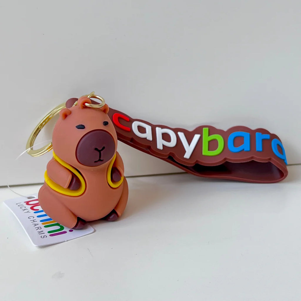 6 unique styles of capybara keychains/ bag charms | carrying a yellow backpack
