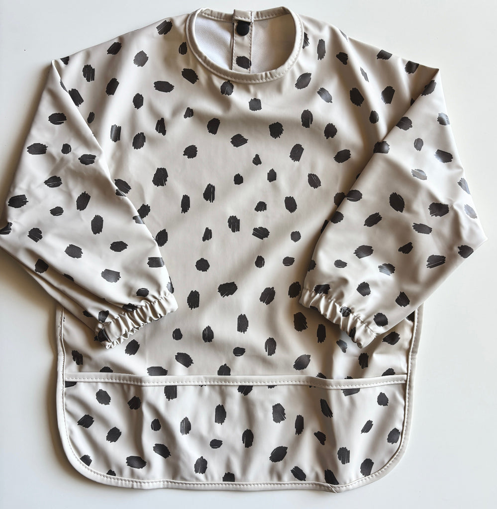 dotted grey bib | long sleeves | waterproof | pocket for catching spills