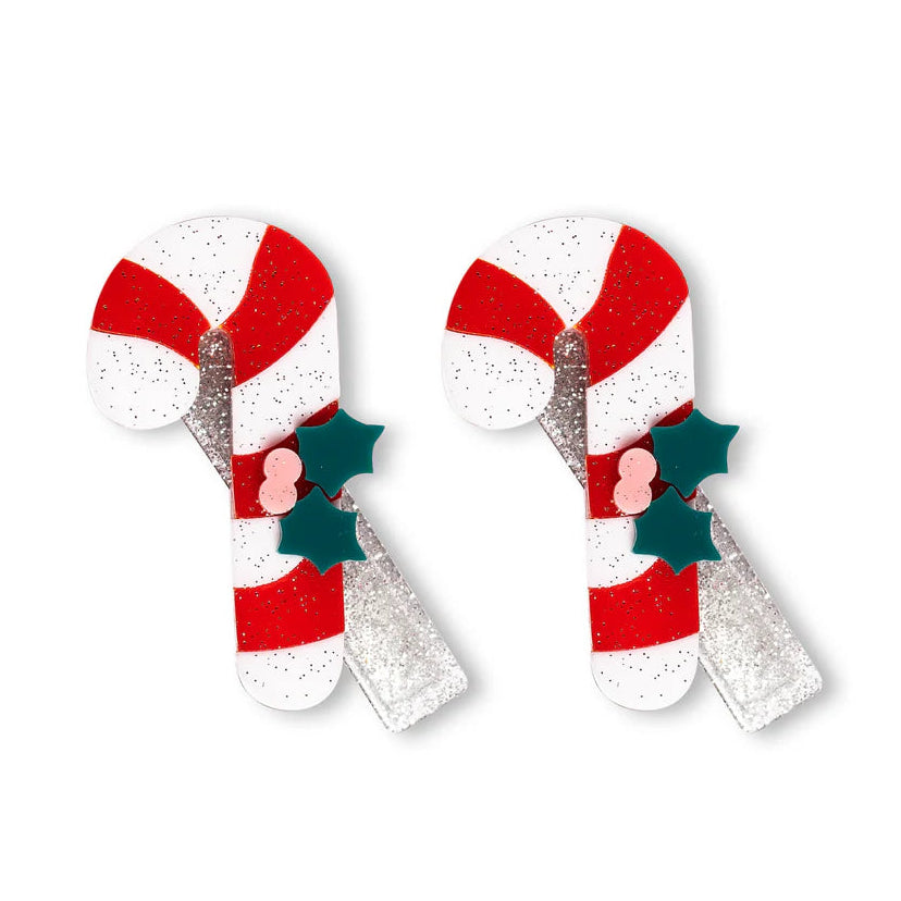 Two candy cane-shaped hair clips with red, white, and green colors 