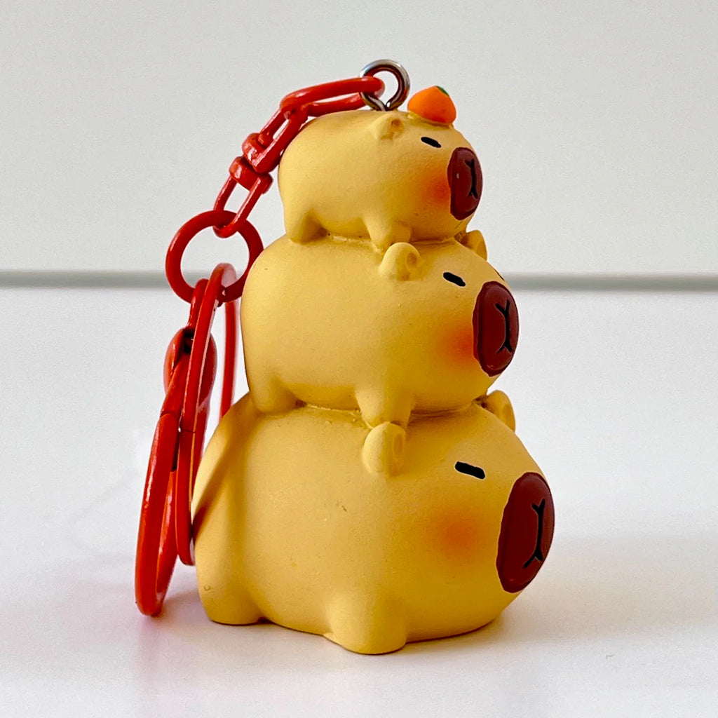 Capybara bag charm | papa/mama/baby capybara shown here |silicon | child safe | has a clip for hanging and key  holder  sold separately