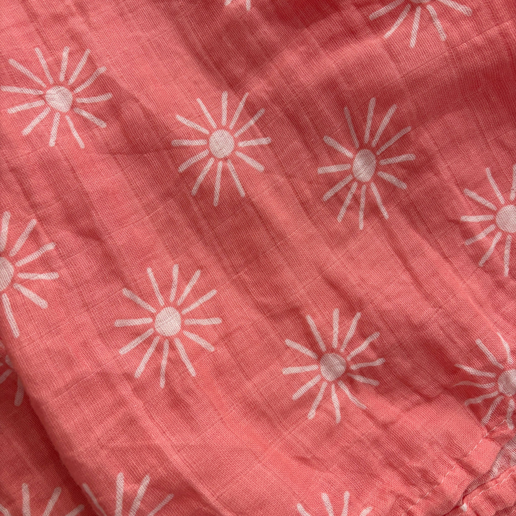Cotton muslin infant swaddle | 45 x 45" \ Coral with white sunbursts