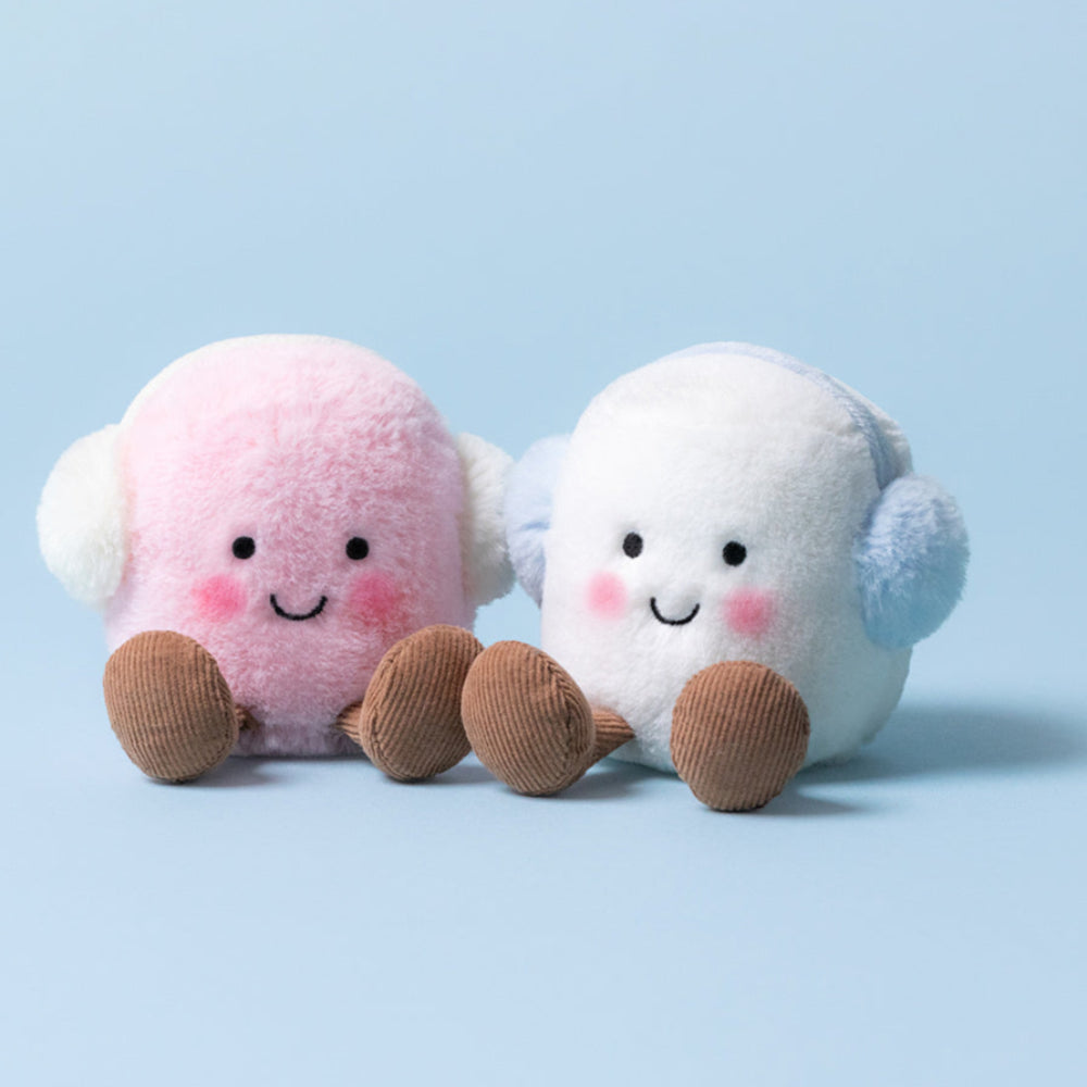 Two plush toys, one pink and one white, with brown feet.