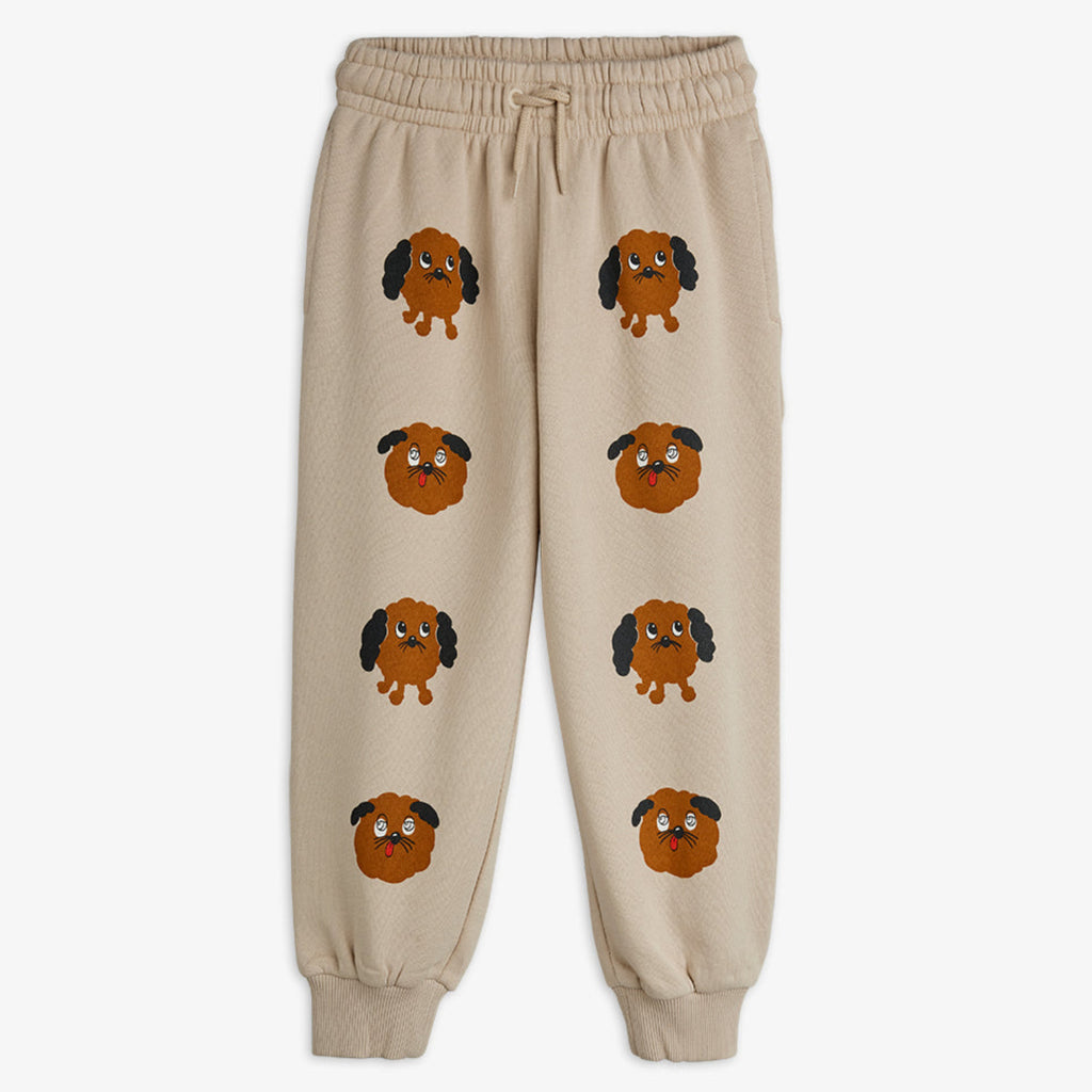 Beige cotton casual pant | elastic waist with drawstring | dog faces down the legs | ribbed at ankles 