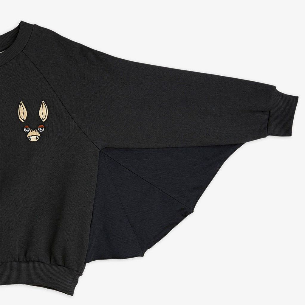 Black cotton Bat sweatshirt | bat sleeves with ribbing around wrist and waist | embroidered bat face on chest |  sleeve closeup