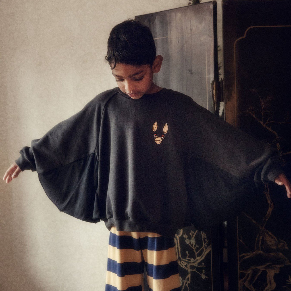 Black cotton Bat sweatshirt | bat sleeves with ribbing around wrist and waist | embroidered bat face on chest |  modeled