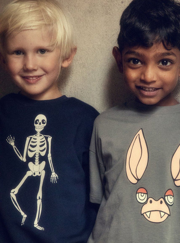 Navy blue cotton sweatshirt ith large bold white skeleton on front | ribbing at neck, wrist, and waist | drop shoulders