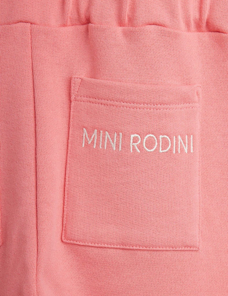 All cotton cotton pink jumpsuit | zip-up front | skeleton graphic on front | elasticized waist in back with 2 pockets | back pocet closeup