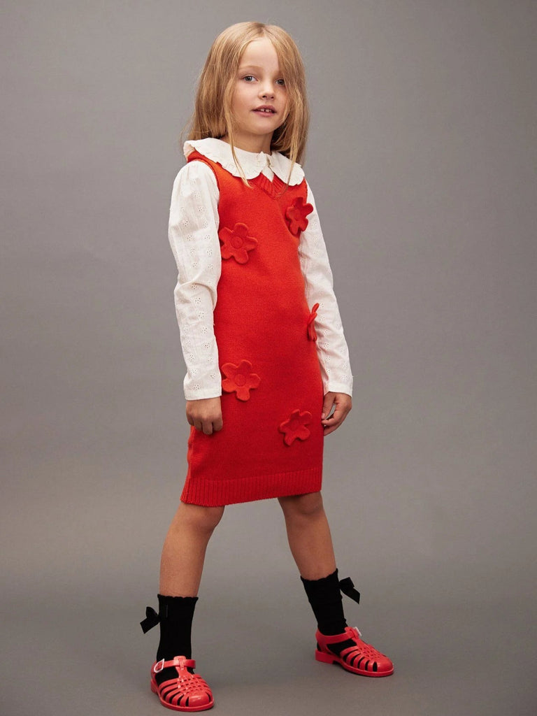 Red knit  sweater dress for girls | mini rodini | wool flowers on front | sleeveless | v-neck | model
