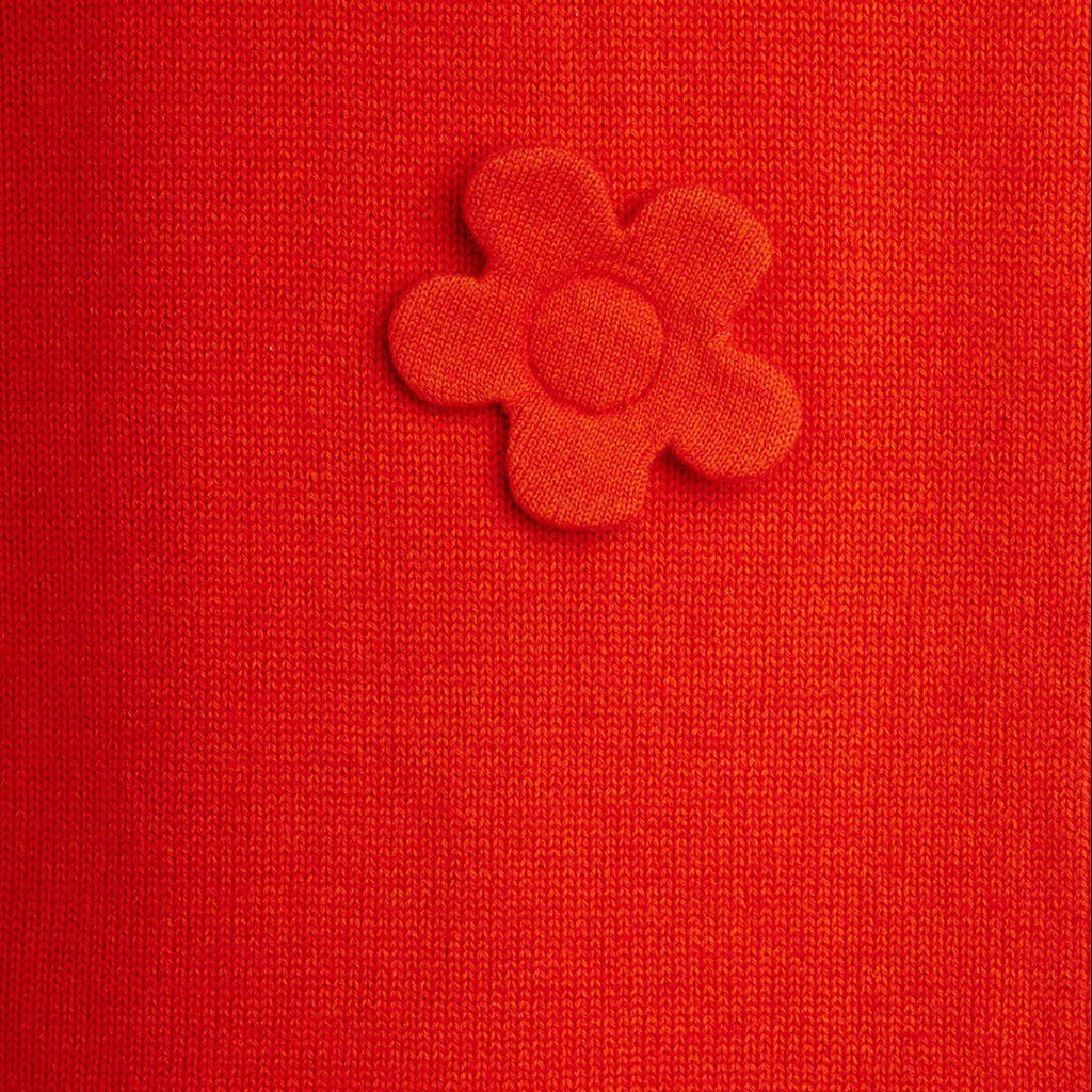 Red knit  sweater dress for girls | mini rodini | wool flowers on front | sleeveless | v-neck | closeup