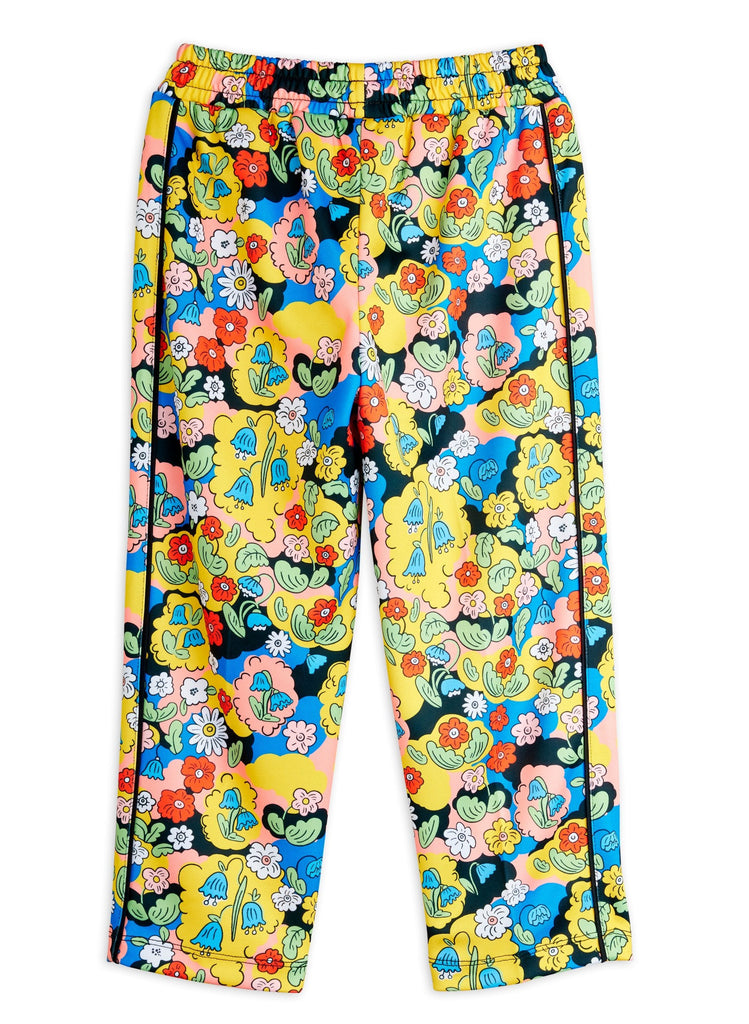 Colorful floral-patterned track pant in soft polyester. Elastic waist, open at ankle, pockets and a cute patch at the hip. Top quality Mini Rodini brand | back of pant