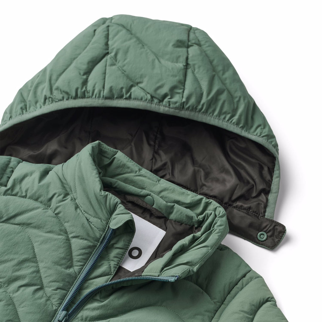 Mist green puffer jacket in sizes 2 thru 14 years | recycled nylon | removable hood | zipper pockets | machine washable | stand-up collar | closeup