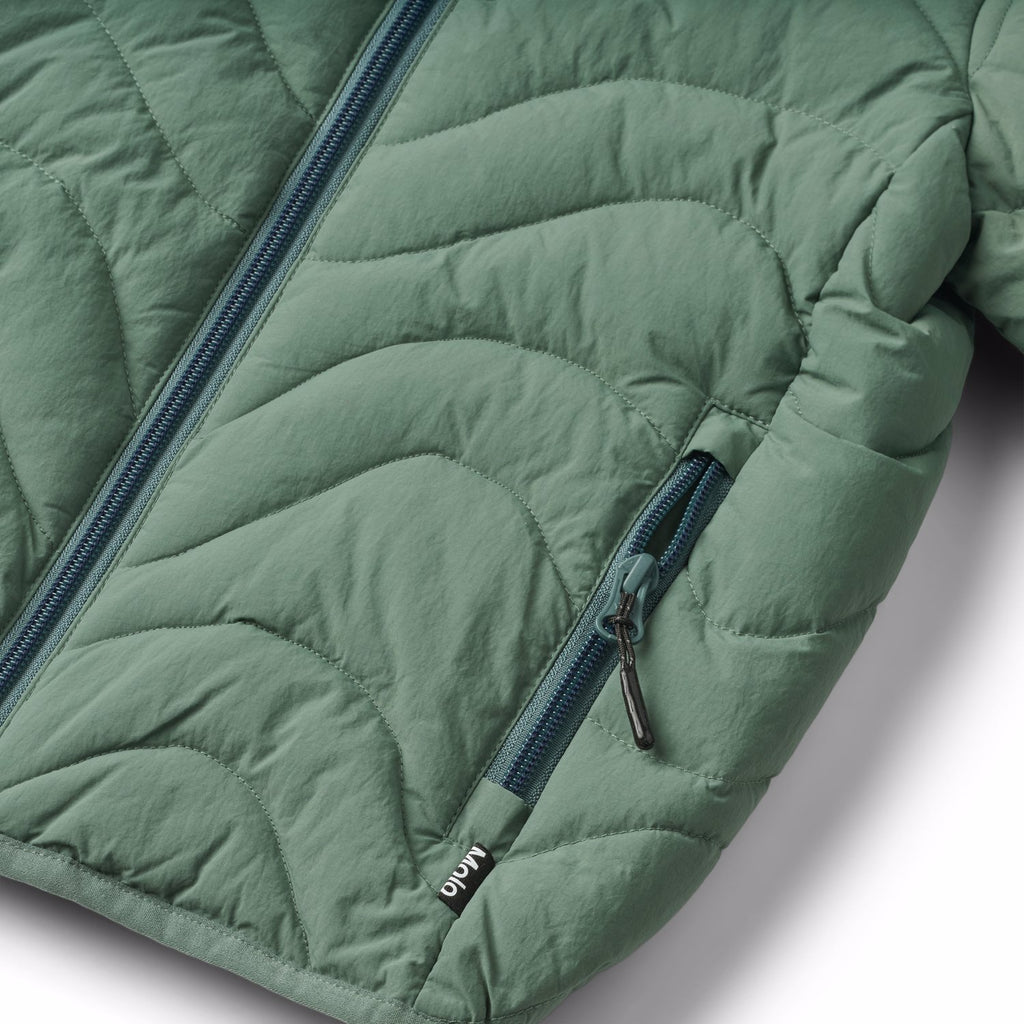 Mist green puffer jacket in sizes 2 thru 14 years | recycled nylon | removable hood | zipper pockets | machine washable | stand-up collar | closeup