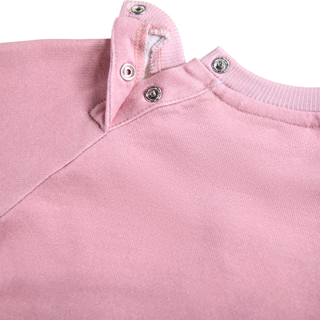 Pink organic cotton sweatshirt | digital print puppies and bows | ribbing at neck/wrist/waist | snap close a back of neck | closeup of snap close
