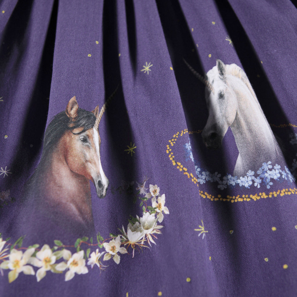 Beautiful plum dress with ribbed jersey top | long sleeves| full skirt of cotton flannel for warmth | twirl skirt | unicorn digital print | closeup