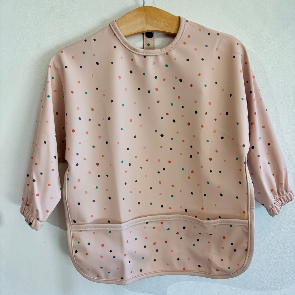 Pink bib with colorful polka dots | long sleeves | waterproof | pocket for catching spills