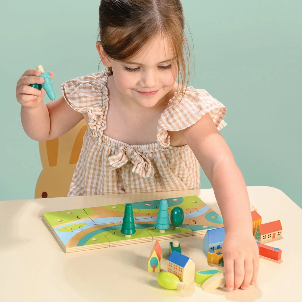 Tiny town jigsaw puzzle with town buildings and vehicles that can be added after the puzzle is complete | child can design any town layout | 12" x 6"  size | ages 3 and up 