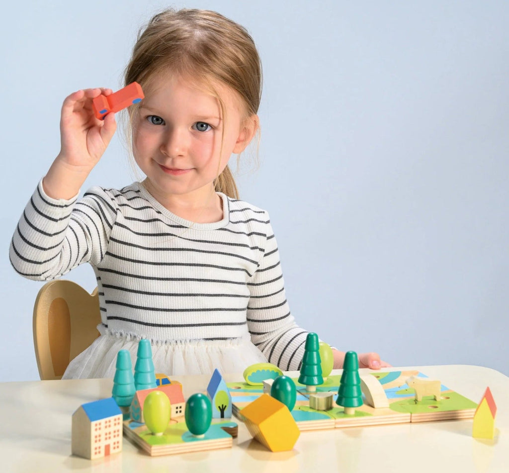 Tiny town jigsaw puzzle with town buildings and vehicles that can be added after the puzzle is complete | child can design any town layout | 12" x 6"  size | ages 3 and up 